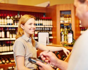 CES Touch EPoS System - What Is Your Inventory Telling You? - Store manager and saleswoman doing inventory with mobile data registration terminal