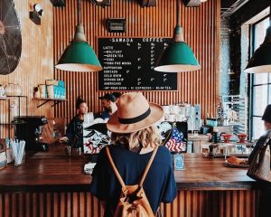 Person in café receiving good customer service